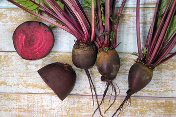 Fresh beets on a wooden surface.  Best diet background.