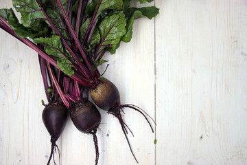 Fresh beets on a wooden surface.  Best diet background.
