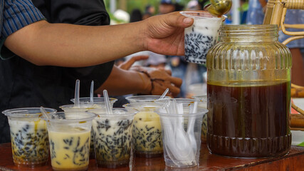 Dawet drink originates from Java in Indonesia, made from glutinous rice flour poured with brown sugar water and coconut milk served with shaved ice.