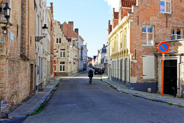 Fototapeta na wymiar Bruges Belgium - 08 01 2023: Historic city center of Brugge, West Flanders province. Ancient medieval architecture of Bruges old town. Canals and stone paving streets cityscape with famous Burg Berg