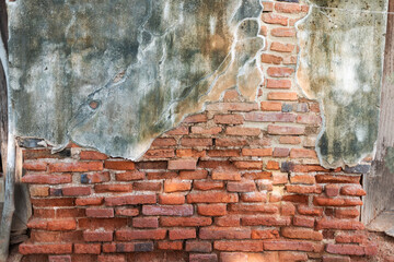 Old red brick and cement wall background The textures and colors look beautiful and have unusual dimensions.