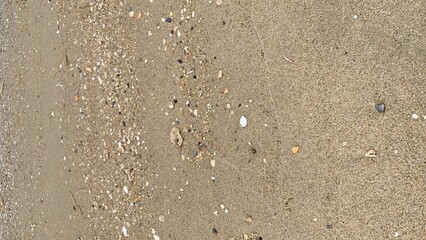 Fototapeta na wymiar sand and water on the beach