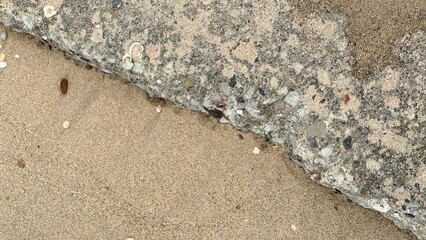 Stone and sand on the beach