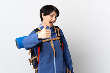 Mountaineer woman over isolated background with thumbs up because something good has happened