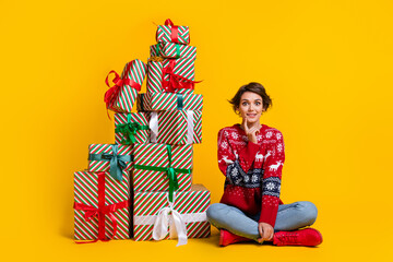 Full body photo of excited woman with stylish hair wear red sweater sit near presents finger on...