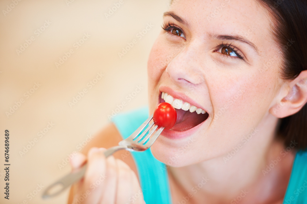 Wall mural Health, diet and face of woman with tomato eating for nutrition, wellness and snack for hunger. Food, happy and smile of person with vegetable salad for vitamins benefits, detox and lose weight