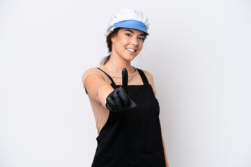 Fishmonger brazilian woman wearing an apron isolated on white background showing and lifting a finger