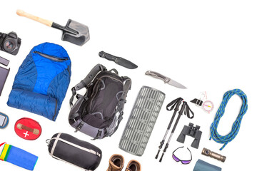Set of tourist trekking items on white background. Top view of accessories for travel. Equipment for travel and hiking. Survival Items.