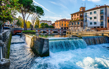 Evening view of the San Martino bridge. Italian city of Treviso in the province of Veneto. View of the river Sile and the architecture of Treviso Italy. Venetian architecture in Treviso, Italy.
