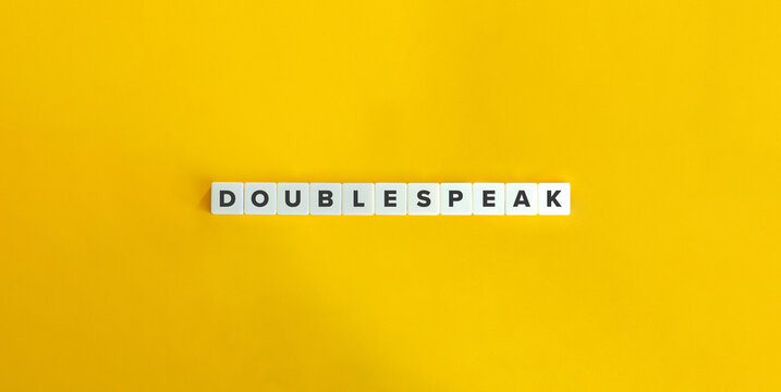 Doublespeak Term on Letter Tiles on Yellow Background. Minimal Aesthetics.