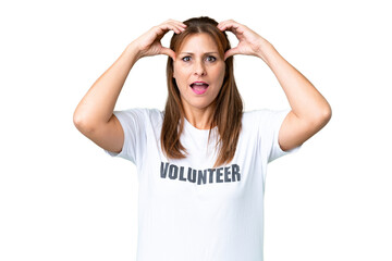 Middle age volunteer woman over isolated background with surprise expression