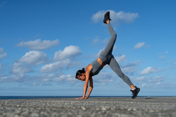 athletic brunette girl doing fitness doing exercises leading a healthy lifestyle