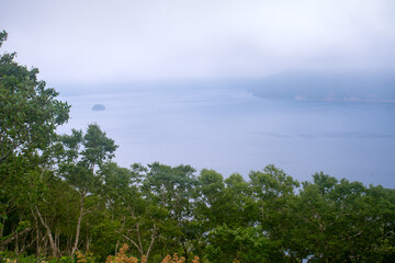 Lake Mashu, an endorheic crater lake formed in the caldera of a potentially active volcano in Akan Mashu National Park, Teshikaga, Kushiro Subprefecture, Hokkaido, Japan