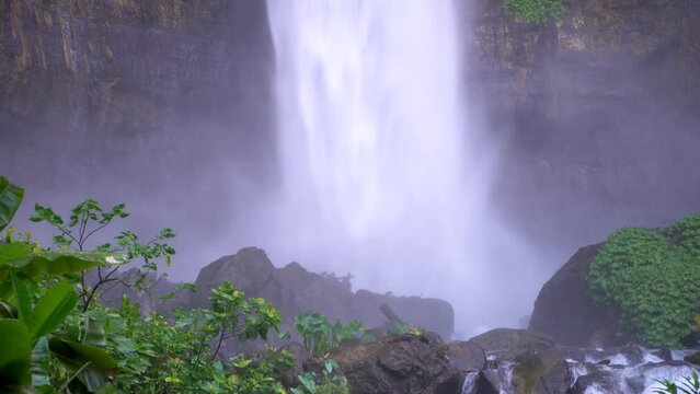 Coban Kapas Biru - Waterfall in the tropical jungle of Java. Indonesia