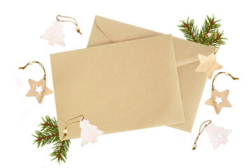 spruce branch. Kraft envelope, flat lay, top view close up. Christmas, holiday details, decoration,...