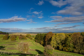 Vista from Burton Dassett Hills on a bright autumnal day with far reaching views over Warwickshire, England - 674722041