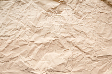 Obraz premium Peach color crumpled paper for background.