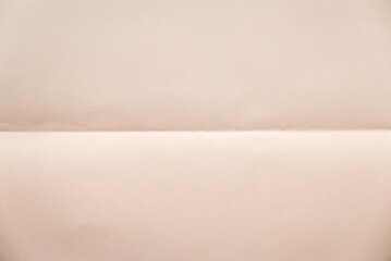 Folded peach color paper for background.
