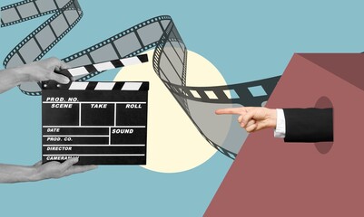 Classic clapper board or film slate and hand