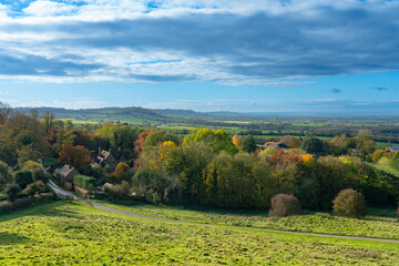 Vista from Burton Dassett Hills on a bright autumnal day with far reaching views over Warwickshire, England - 674727811