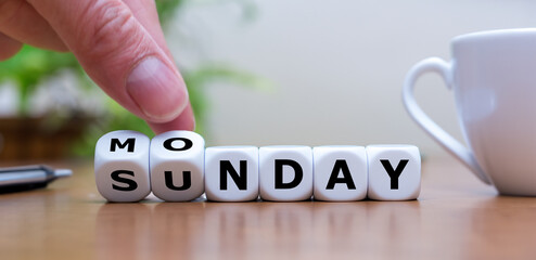 Symbol for a fresh start into the new week. Hand turns dice and changes the word Sunday to Monday.