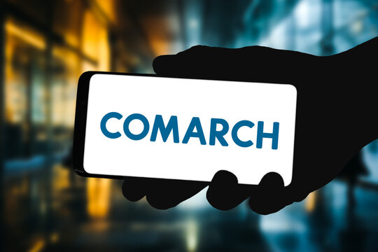 Smartphone displaying logo of Comarch
