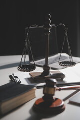 Business and lawyers discussing contract papers with brass scale on desk in office. Law, legal...