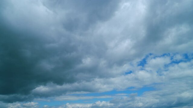 Dark Huge Cloud In Sky. Massive Cumulus Clouds Rolling. Wind Disperses Clouds On A Rainy Day. Timelapse.