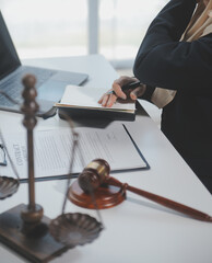 Business and lawyers discussing contract papers with brass scale on desk in office. Law, legal...