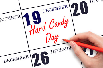 December 19. Hand writing text Hard Candy Day on calendar date. Save the date.