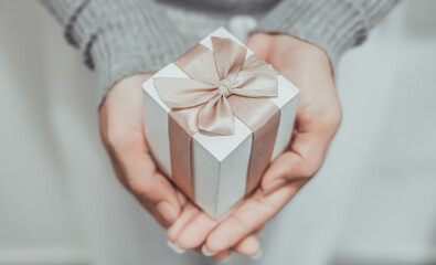 Romantic gift box 2024, Females holding Christmas gift box decorated with Christmas and New Year...