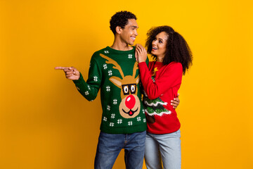 Obraz premium Photo of cool dreamy lady guy wear new year ugly print sweaters showing finger empty space isolated yellow color background