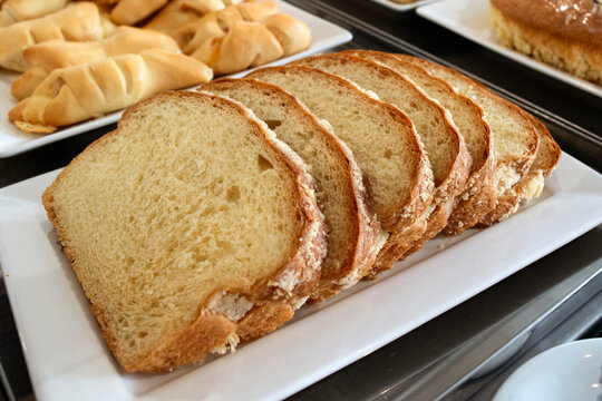 Close-up slices of Cuca on white plate. Traditional German recipe of a sweet bread and also made in southern Brazil, by immigrants.