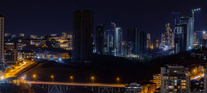 Beautiful panoramic cityscape of Cankaya, Oran and Dikmen districts in Ankara at night. Long exposure photography of Dikmen Valley Bridge and surrounding buildings.