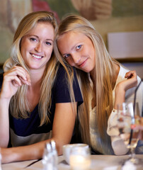 Portrait, women or friends in a cafe, smile or relax with happiness, bonding together or funny. Face, people or girls with conversation, cheerful or restaurant with gossip, sharing secret or speaking