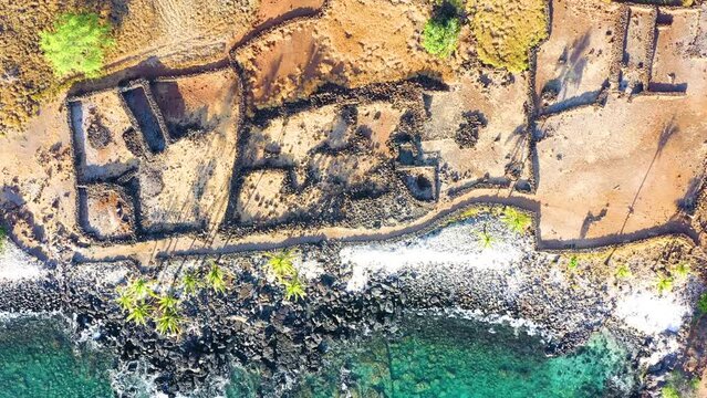 Aerial drone view of the ruins of the ancient Hawaiian village at Lapakahi State Historical Park, Hawaii Island, Hawaii.