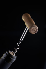 corkscrew with cork on dark copy space