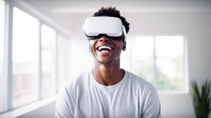 Portrait of happy smiling passionate african american black male person wearing virtual reality headset in white room.