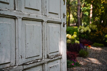 White wooden door in the garden area.