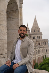Close-up of a young male tourist at the famous Fisherman's Bastion in Budapest.