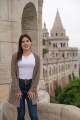 Beautiful young tourist woman posing at the famous Fisherman's Bastion in Budapest