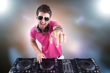 Cool hipster dj performing in a nightclub with controller