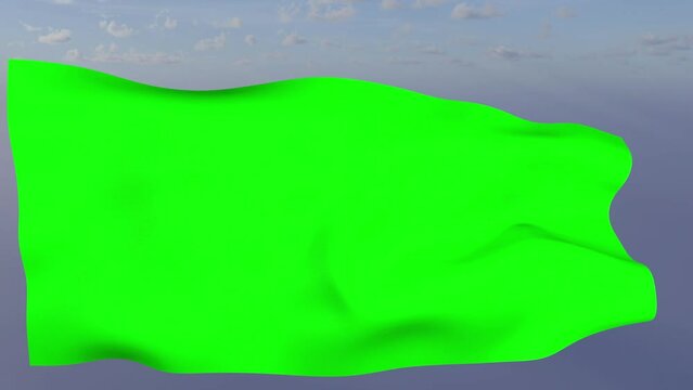 Loop der gr&uuml;ne Fahne wehend im Wind als Nahaufnahme 4K