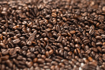 A pile of many freshly roasted and fragrant coffee beans can be used as a background or illustration.