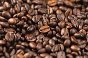 A close-up of freshly roasted coffee beans can be used as a background or illustration.