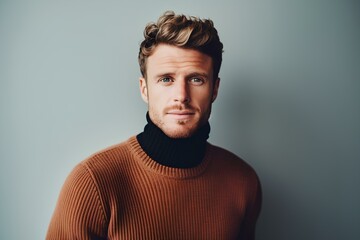 Obraz premium Stylish man in a turtleneck sweater, on a minimalistic simple bright background. generative AI