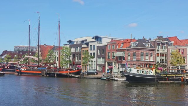 Traditional houses beside a canal in Leiden - South Holland, the Netherlands 