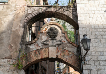 Medieval arch. Gate leading to the entrance to the Kotor fortress, Montenegro. inscription in Latin reads "Regia Minutiae Rupees Via" and points the way to the fortifications 