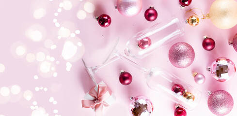 Christmas party with champagne glasses on pink background banner