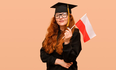 Student on her graduation day wearing a bachelor's cap with the Polish flag.